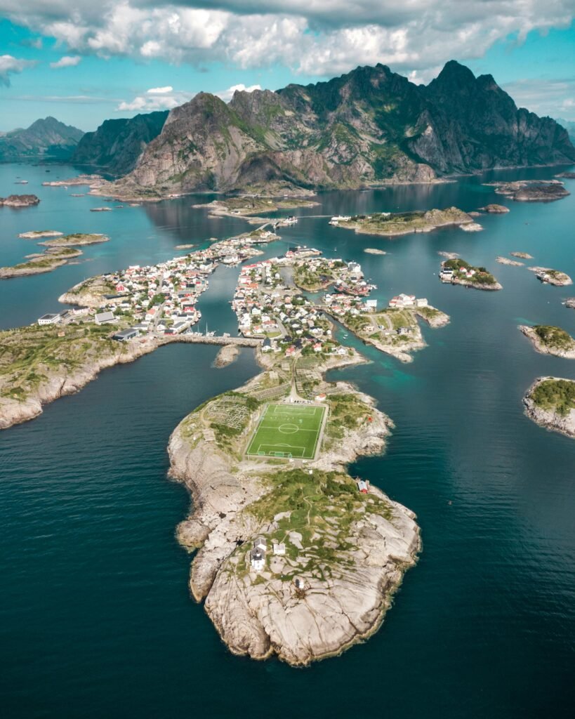 Stunning aerial shot of Henningsvær village and surrounding islands in Lofoten, Norway.